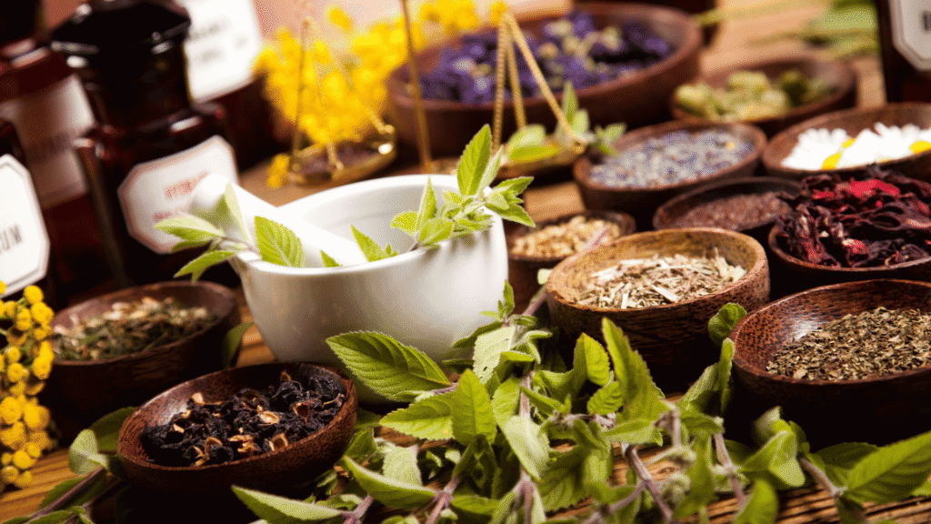 Natural liver-supporting herbs like milk thistle and artichoke arranged on a wooden surface.