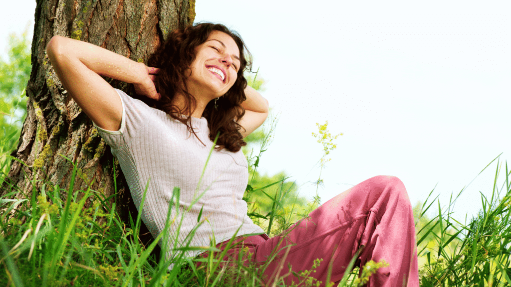 Healthy woman walking outdoors in nature, symbolizing energy and wellness through natural lifestyle choices