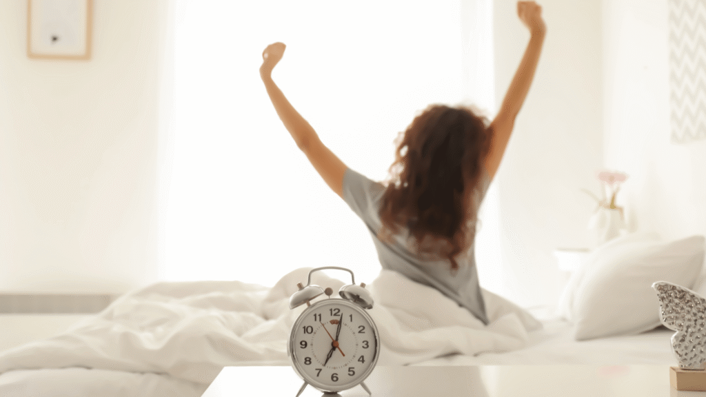 A woman stretching by a window, symbolizing renewed energy and wellness from natural liver detox.