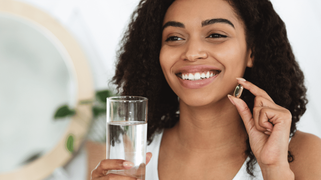 Individual taking a natural supplement with healthy food on the table, promoting wellness routine