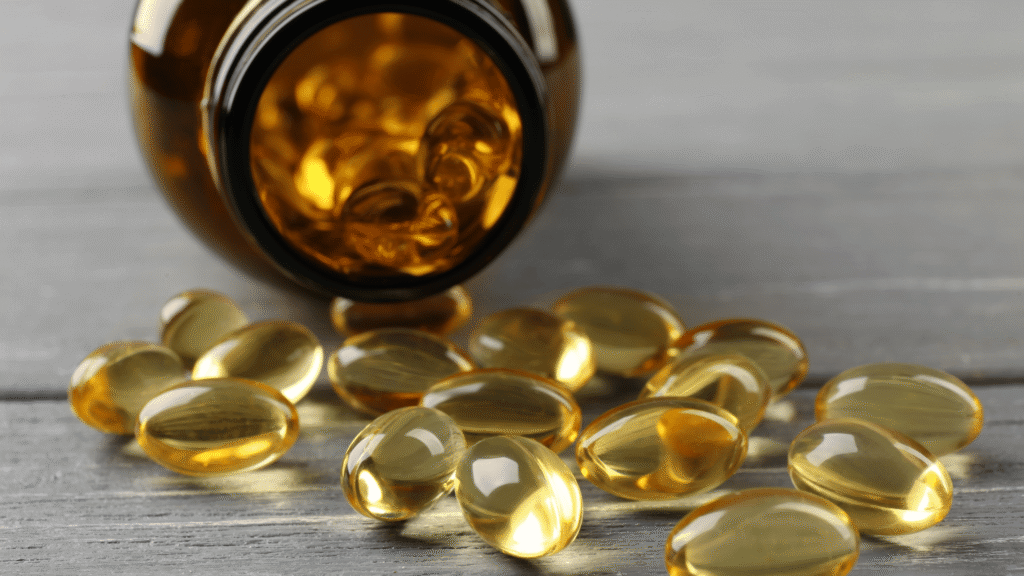 Natural liver detox supplement in capsule form beside green leaves, representing safe and organic liver support.