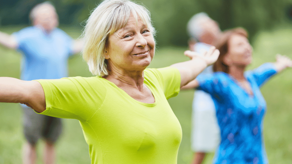 A woman stretching outdoors, representing light physical activity as part of a healthy home liver detox routine.