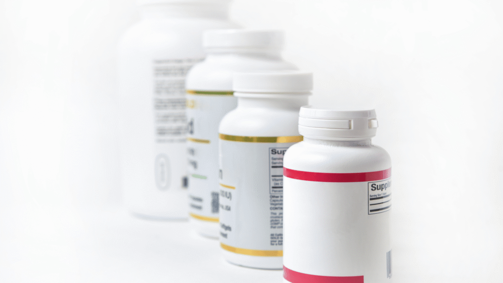 A bottle of the HepatoBurn natural supplement placed next to fresh ingredients, illustrating its role in liver health support.

