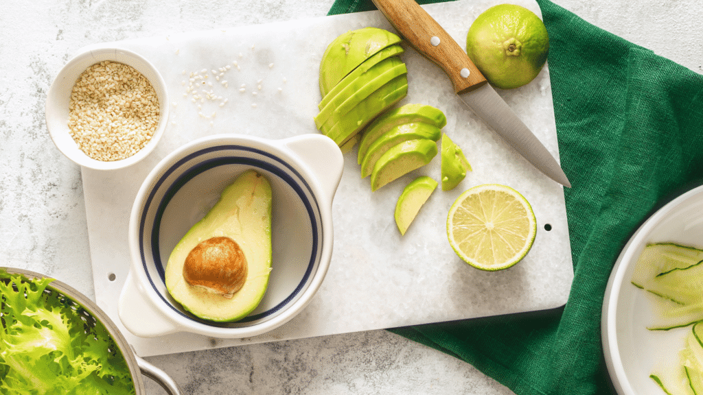 Flat lay of liver-friendly detox foods like avocado, lemon, and leafy greens representing natural liver support.