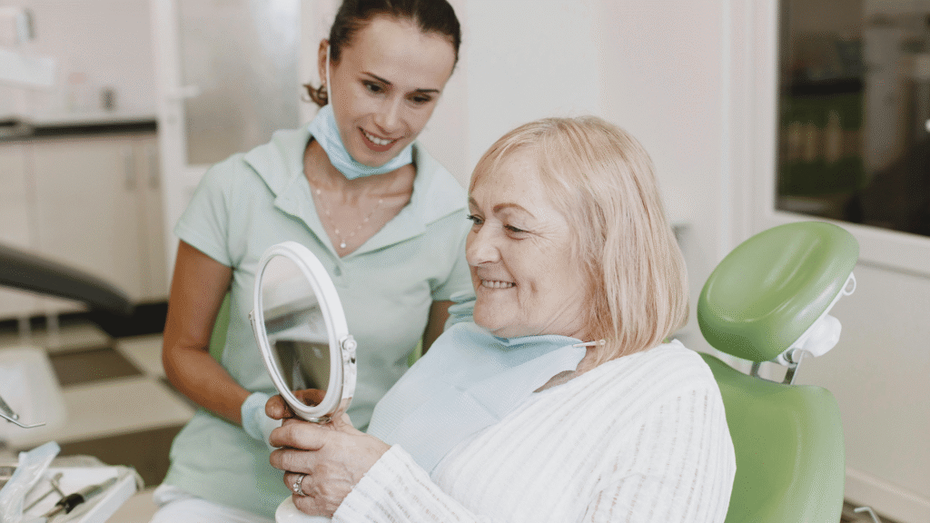 Woman examining her facial skin in the mirror, checking for signs that could indicate liver health concerns