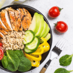 A healthy meal featuring leafy greens, avocado, and lean protein, ideal for supporting natural liver detox through diet.